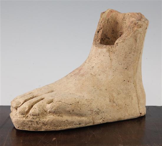 An Etruscan terracotta votive left foot, c.3rd century BC, 21cm, repaired